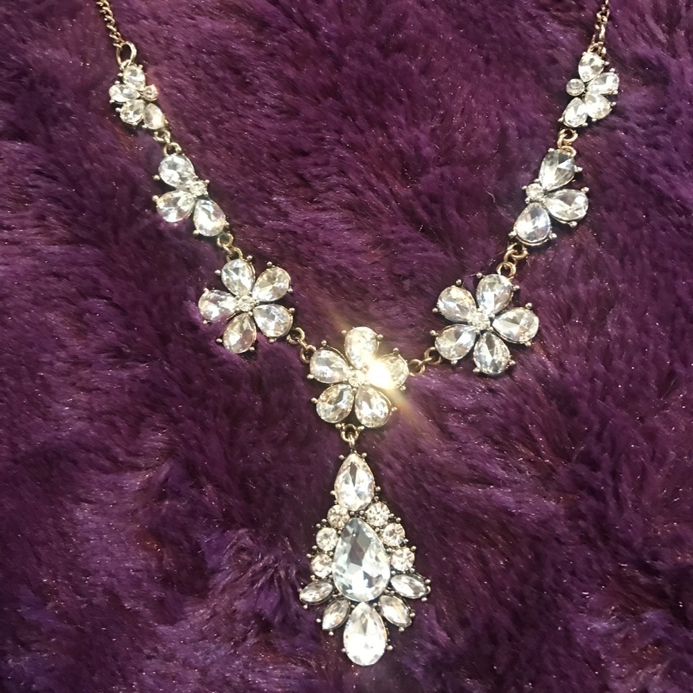 Sparkly crystal necklace on golden chain